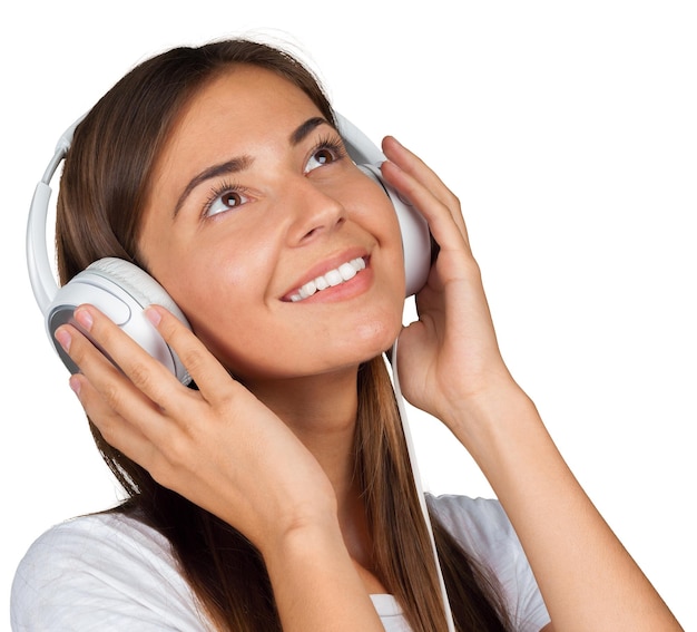 Portrait of a beautiful woman student listening to music