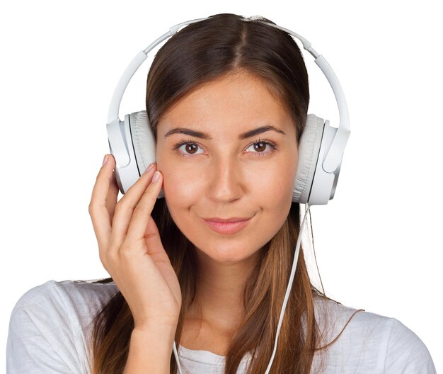 Portrait of a beautiful woman student listening to music