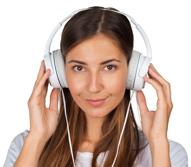 Portrait of a beautiful woman student  listening to music