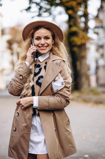 Portrait of beautiful woman talking on the phone