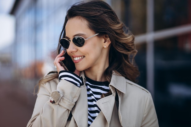 Portrait of beautiful woman talking on the phone