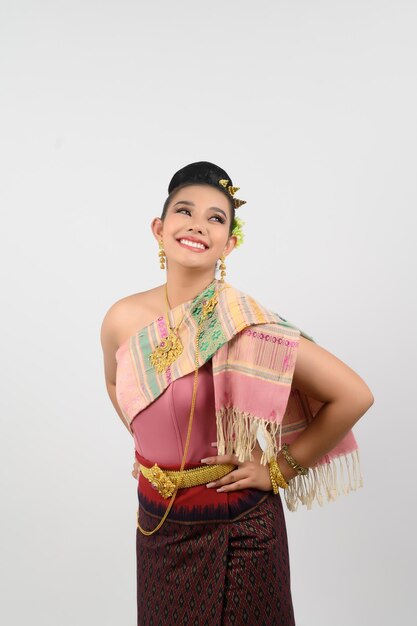 Portrait of Beautiful Woman in Thai northeastern Traditional Clothing standing Posing