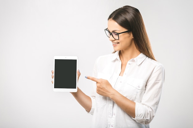 Portrait of a beautiful woman using tablet computer