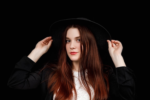 Portrait of a beautiful woman wearing jacket and a hat