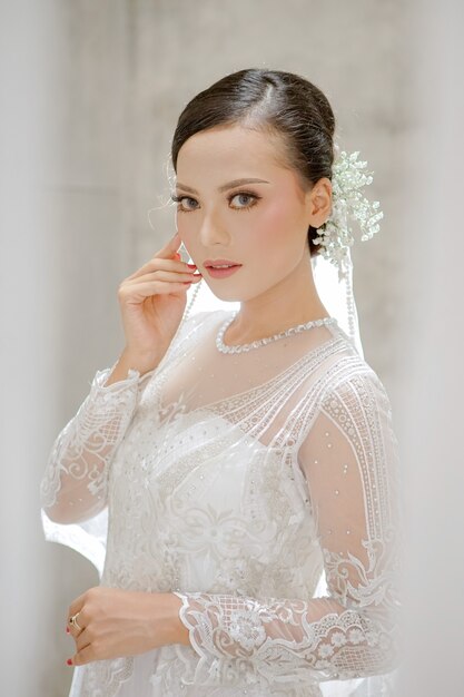 Portrait of beautiful woman wearing white wedding dress