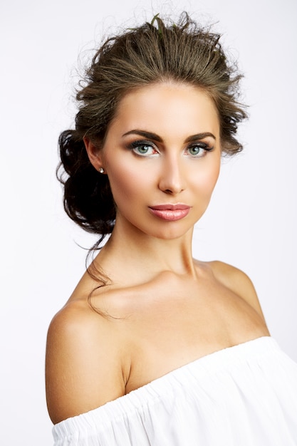 Portrait of beautiful woman on white background