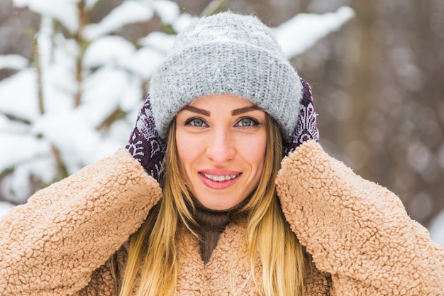 Portrait of a beautiful woman with braces on teeth. Smiling girl with dental braces. Happy smiling