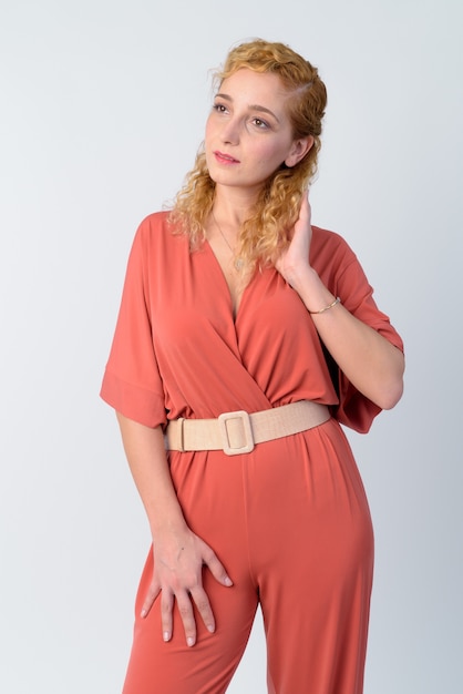 Portrait of beautiful woman with curly blond hair on white