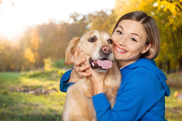 Portrait of  beautiful woman with  dog on background