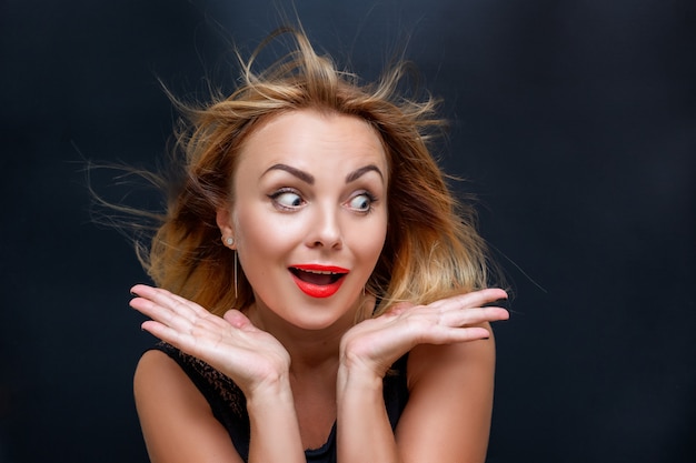 Portrait of a beautiful woman with a facial expression of surprise