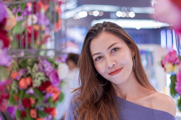 Portrait of a beautiful woman with a flower arch