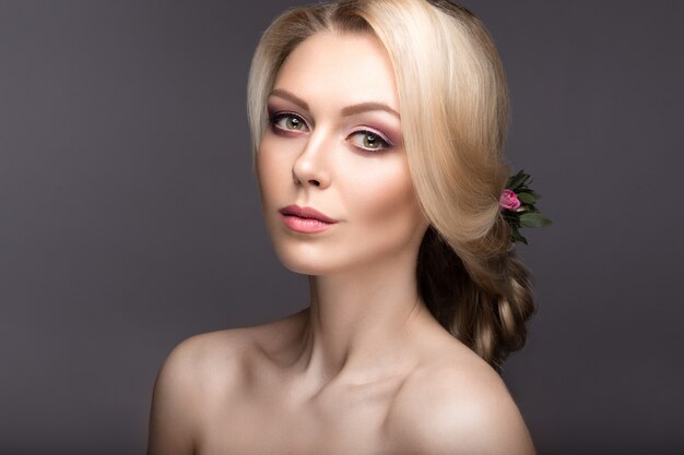 Portrait of a beautiful woman with flowers in her hair