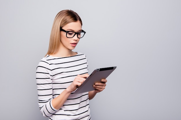 portrait of beautiful woman with glasses and tablet