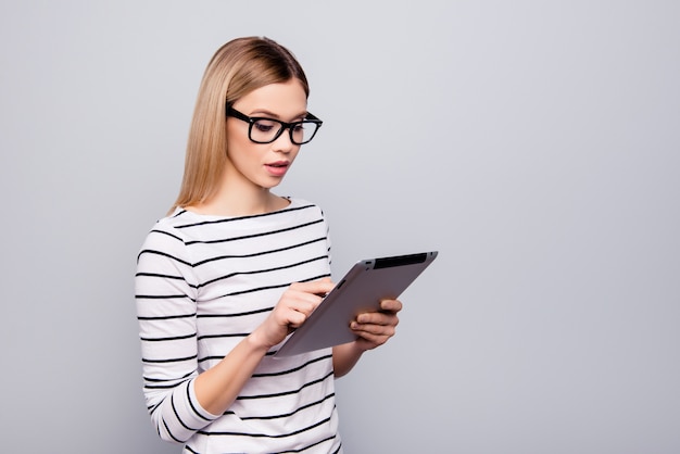 Portrait of beautiful woman with glasses and tablet