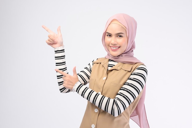 Portrait of beautiful woman with hijab is smiling on white background