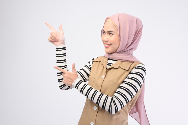 Portrait of beautiful woman with hijab is smiling on white background