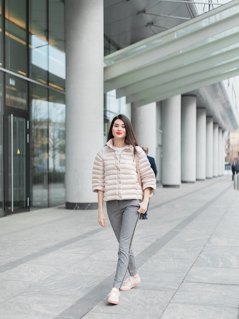 portrait beautiful woman with red lips and backpack