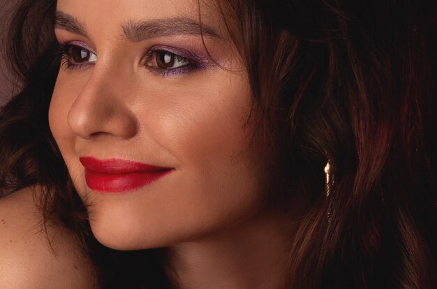 Portrait of a beautiful woman with red lips