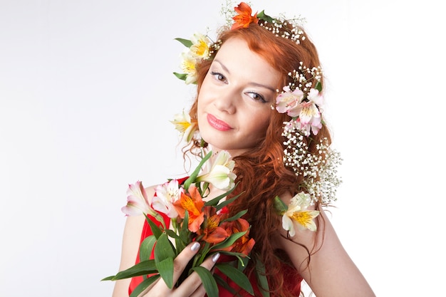 Portrait of beautiful woman with spring flowers