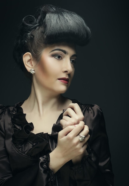 Portrait of a beautiful woman with stylish hairstyle and makeup