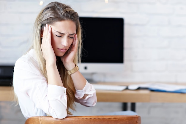 Portrait of beautiful woman working in modern home office