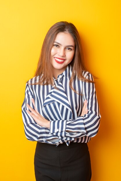 Portrait of Beautiful woman on yellow background 