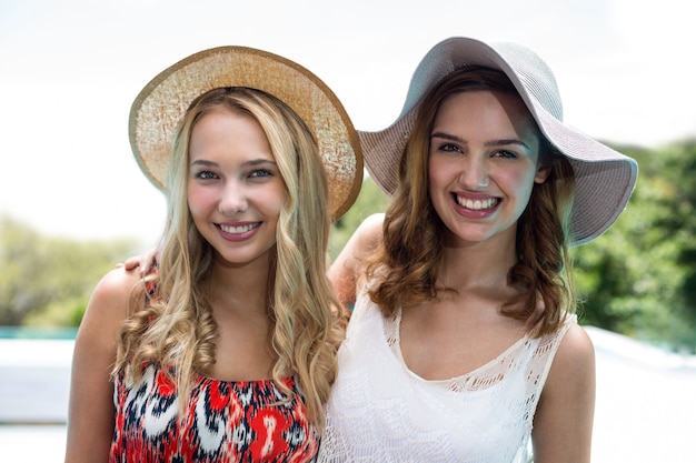 Portrait of beautiful women having fun near pool