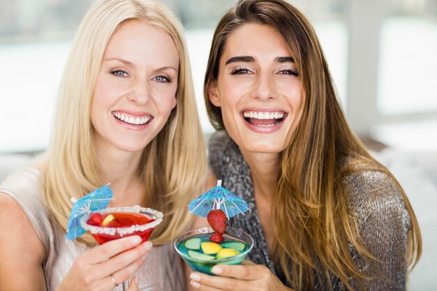 Portrait of beautiful women smiling and having mocktail