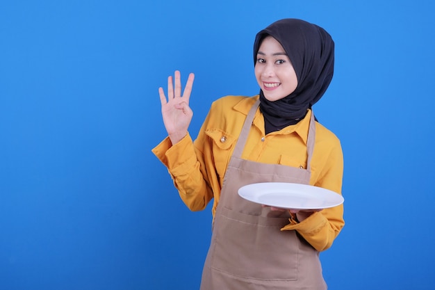 Portrait beautiful young asian woman pointing four step on blue