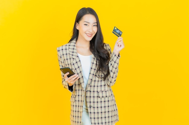 Portrait beautiful young asian woman smile with credit card