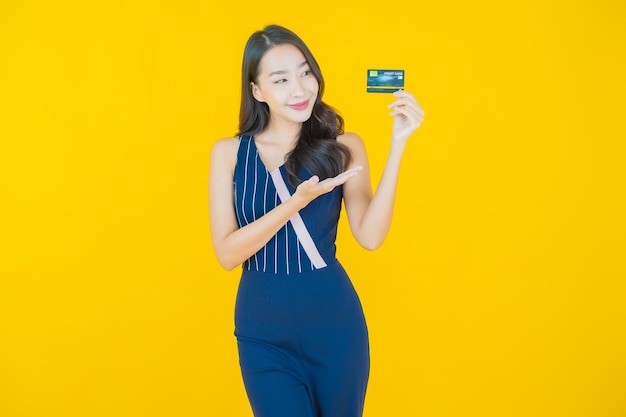 Portrait beautiful young asian woman smile with credit card on