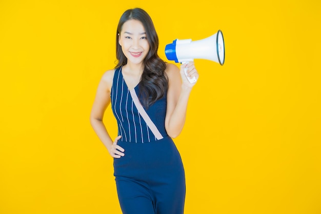 Portrait beautiful young asian woman smile with megaphone on