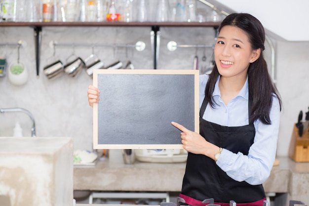 Portrait of beautiful young barista asian woman 