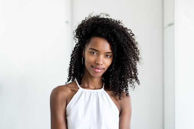 Portrait of a beautiful young black woman looking into camera