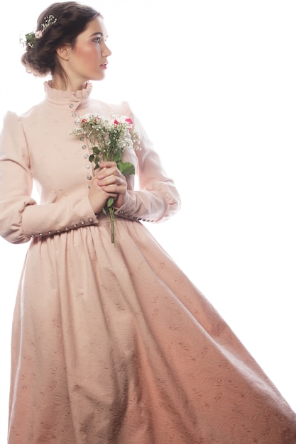 Portrait of beautiful young bride in pink dress