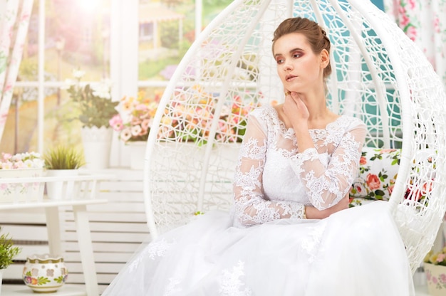 Portrait of beautiful young bride wearing wedding dress