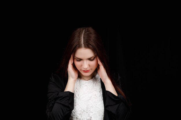 Portrait of beautiful young brunette feeling stressed or headache