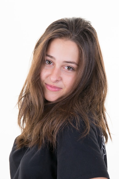 Portrait of beautiful young brunette smiling teen girl