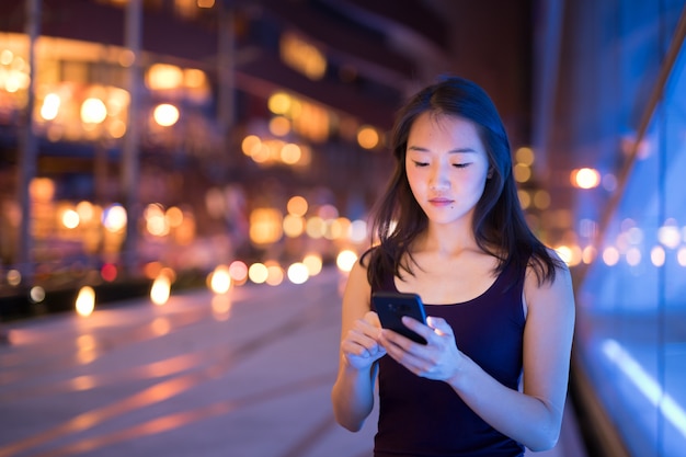 Portrait Of Beautiful Young Chinese Woman Outdoors At Night