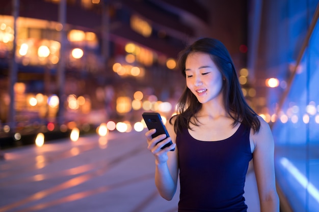 Portrait Of Beautiful Young Chinese Woman Outdoors At Night