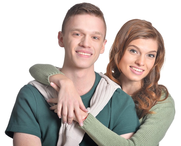 Portrait of a beautiful young couple on a white background