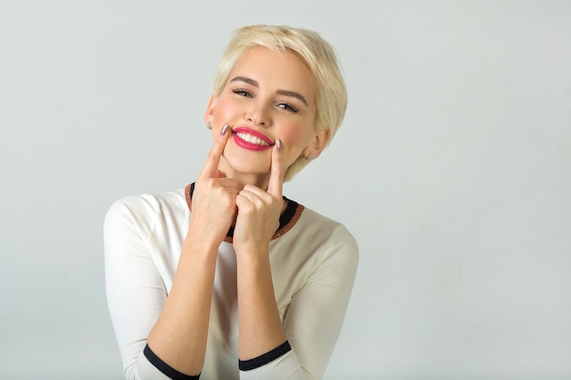 portrait of beautiful young female with short haircut and makeup