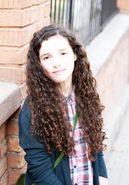 Portrait of beautiful young girl in the city