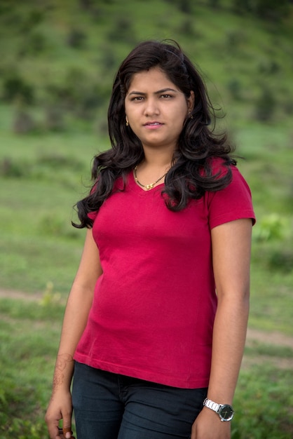 Portrait of beautiful Young girl outdoors in park.