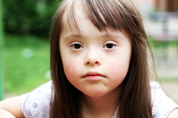 Portrait of beautiful young girl in the park