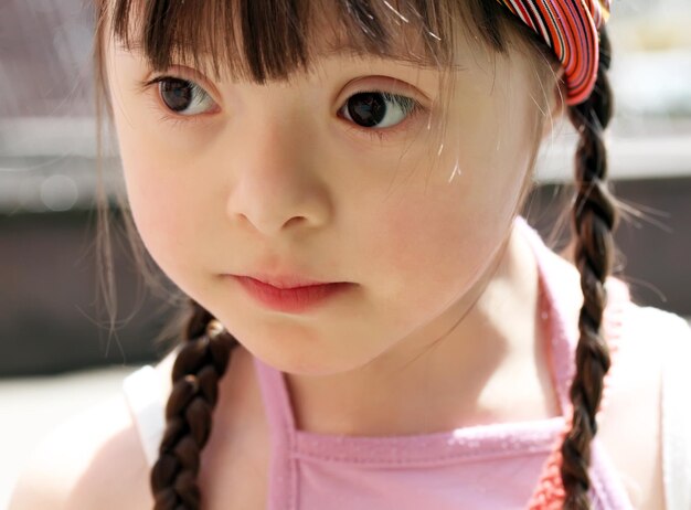 Portrait of beautiful young girl on the playground.