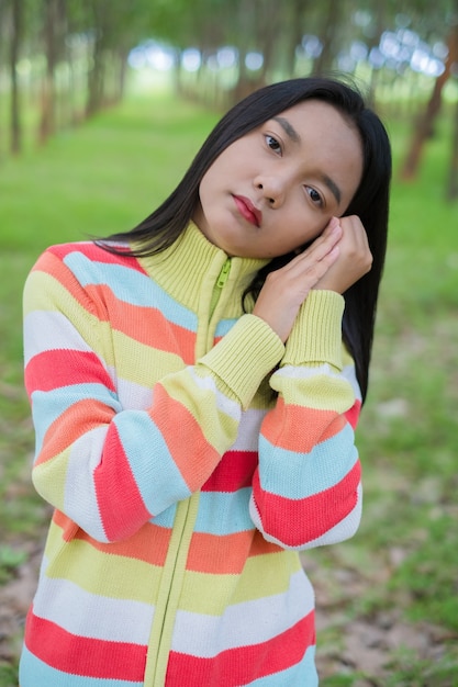 Portrait beautiful young girl wear sweater on nature background