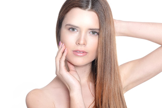 Portrait of a beautiful young girl on a white background