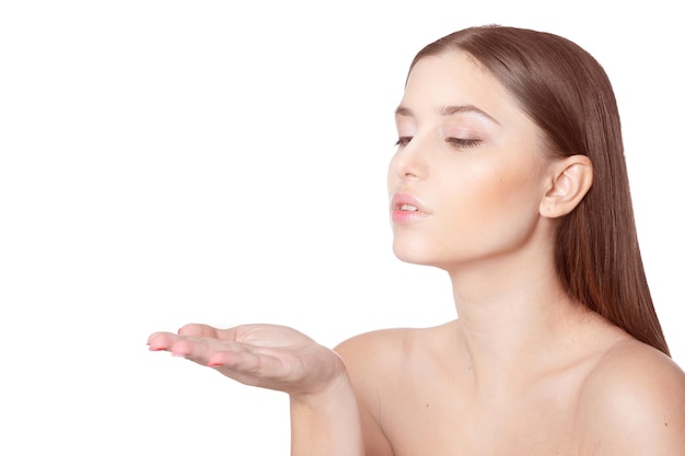 Portrait of a beautiful young girl on a white background