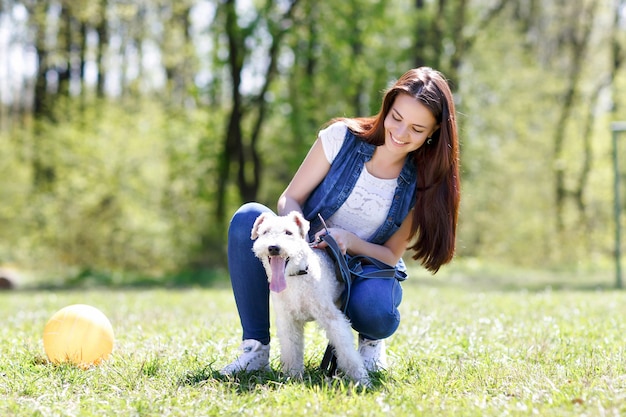 Portrait of Beautiful young girl with her dogs